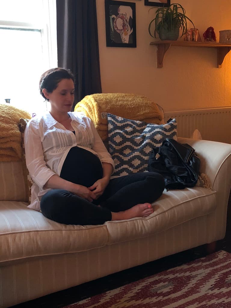 Pregnant woman relaxing during a hypnobirthing session